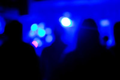 Defocused image of illuminated lights at music concert