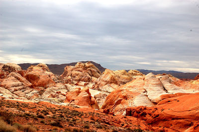 Rock formations at red rock canyon national conservation area against cloudy sky