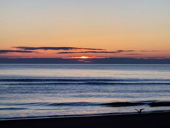 Scenic view of beach during sunset