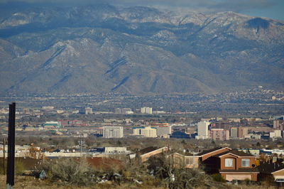 Cityscape with mountain range in background