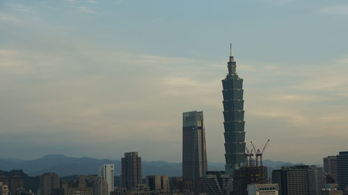 Modern buildings in city against sky