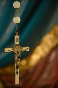 Close-up of cross hanging in temple