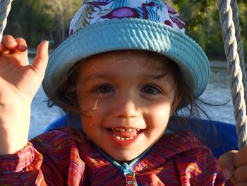 Portrait of smiling girl outdoors during sunny day