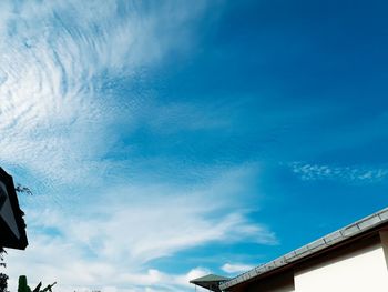 Low angle view of building against blue sky