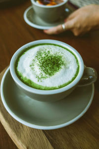 Matcha tea and bamboo matcha whisk.