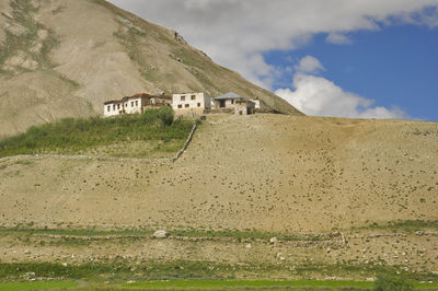 View of traditional ladakhi houses along the dry hills on the way to darcha-padum road.