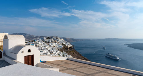 High angle view of buildings by sea