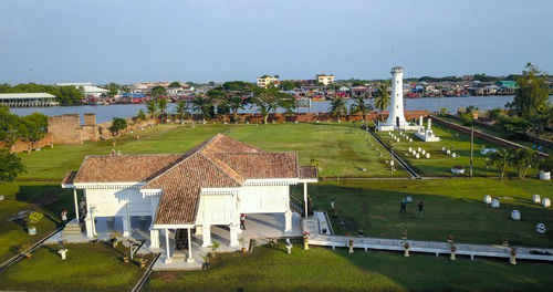 High angle view of houses on field against sky