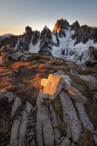 Scenic view of snowcapped mountains against sky during sunset