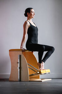 Young woman exercising at gym