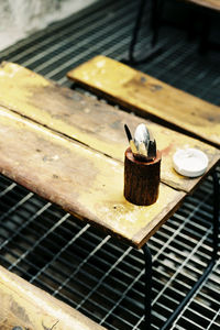 High angle view of cigarette on metal