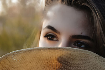 Portrait of young woman wearing hat