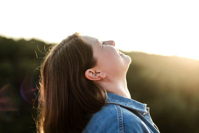 Portrait of beautiful woman against sky