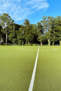 Scenic view of soccer field against sky