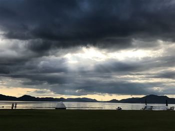 Scenic view of beach against sky during sunset