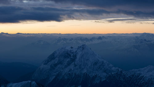 Scenic view of mountains against sky during winter