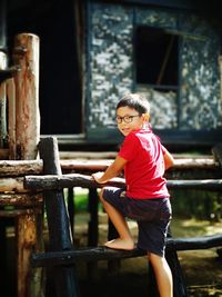 Portrait of smiling girl sitting outdoors