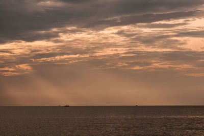 Scenic view of sea against sky at sunset