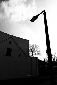 Low angle view of silhouette built structure against sky