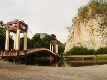 Bridge over lake against sky