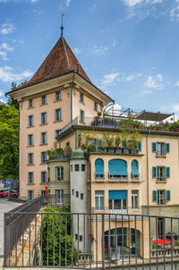 Historic homes on the bank of the aare river in bern, switzerland