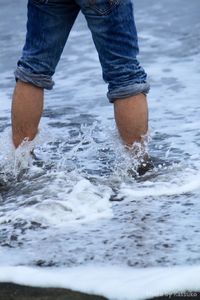 Low section of woman in water