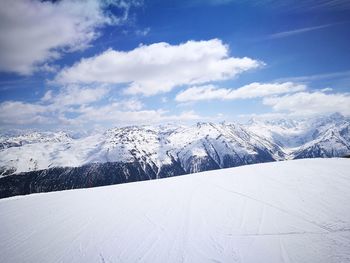 Scenic view of snowcapped mountains against sky