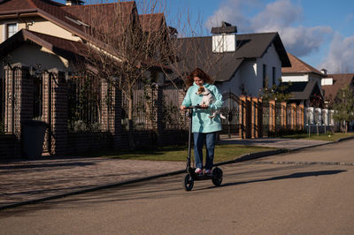 Rear view of woman walking on street