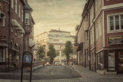 Street in city against sky