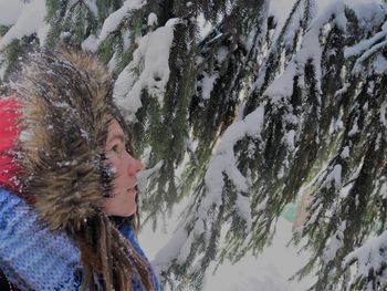 Close-up of woman with dreadlock in snow