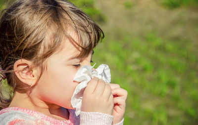 Close-up of girl drinking water