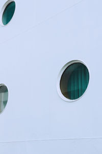 Low angle view of glass building against sky