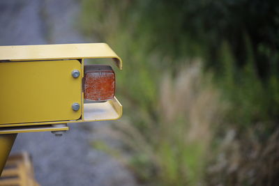 Close-up of yellow vintage car on field