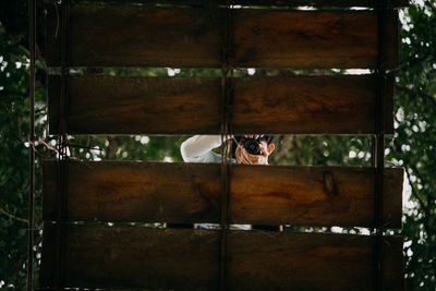 Portrait of man sitting by window