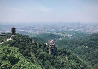 High angle view of trees and buildings against sky