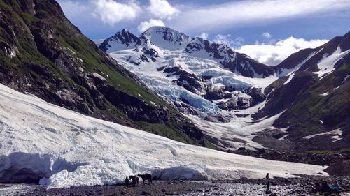 Scenic view of snowcapped mountains against sky