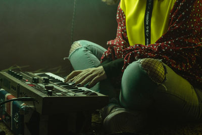 Woman sitting at market stall