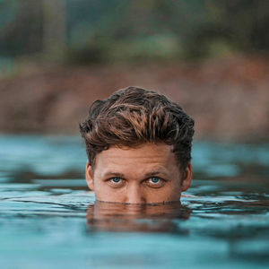 Portrait of boy swimming in lake