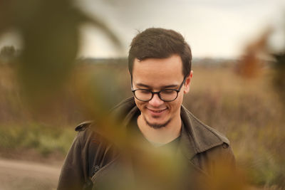 Young man standing on field