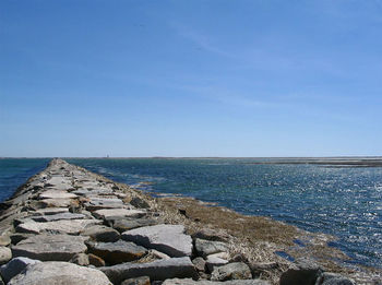 Surface level of narrow walkway along calm sea