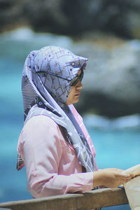 Woman wearing hijab standing outdoors