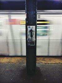 Blurred motion of train at railroad station