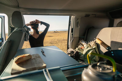 Rear view of woman standing outdoors