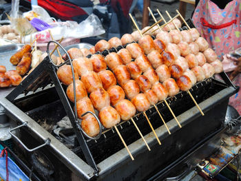 Close-up of meat on barbecue at market