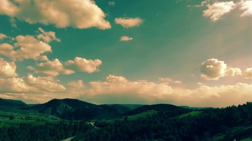 Scenic view of landscape against cloudy sky