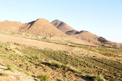 Scenic view of rocky mountains against clear sky