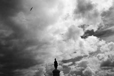 Low angle view of statue against sky