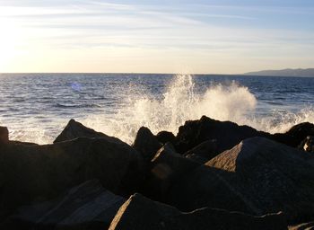 Waves breaking on rocks on beach