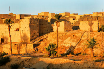 Townscape at erg chebbi desert against sky