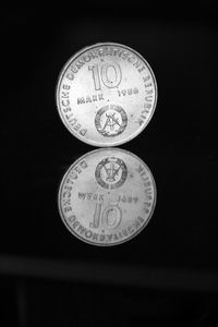 Close-up of coin against black background